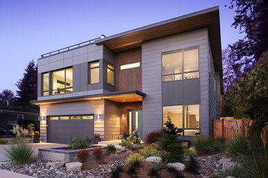 Large minimalist two-story mixed siding exterior home photo in Seattle