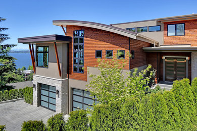 Modelo de fachada de casa moderna de tres plantas con revestimientos combinados y tejado plano