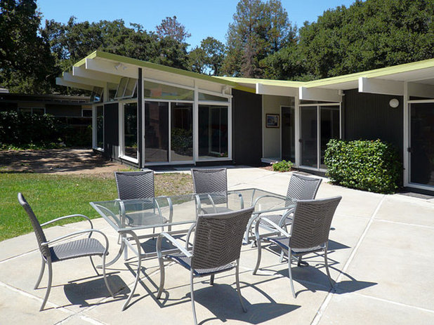 Midcentury Exterior by Klopf Architecture