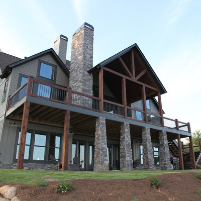 Example of a mid-sized arts and crafts green two-story mixed siding exterior home design in Atlanta with a shingle roof