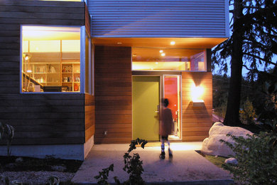 This is an example of a small industrial two floor house exterior in Seattle with mixed cladding.