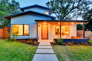 Inspiration for a large white two-story mixed siding house exterior remodel in Austin