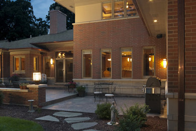 Example of a classic brick exterior home design in Chicago