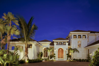 Design ideas for a mediterranean house exterior in Miami.