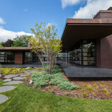 Lac La Belle - Modern Brick Lake Home Modern Landscape