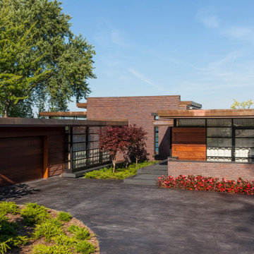 Lac La Belle - Modern Brick Lake Home with Dock and Boathouse