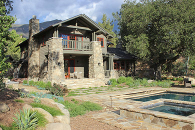 Large craftsman green two-story wood exterior home idea in Los Angeles