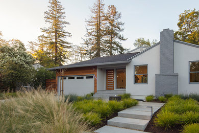 Inspiration for a mid-sized 1960s white one-story mixed siding house exterior remodel in San Francisco with a shingle roof