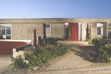 Large minimalist gray one-story concrete flat roof photo in Orange County