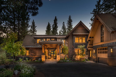 Large and brown rustic two floor house exterior in Sacramento with mixed cladding and a pitched roof.
