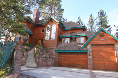 Example of a large classic brown two-story wood exterior home design in Los Angeles