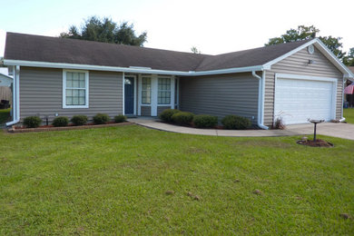 Design ideas for a medium sized and beige bungalow house exterior in Jacksonville with vinyl cladding.