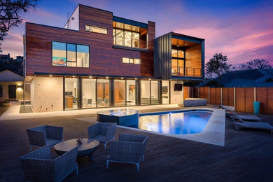 Inspiration for a modern multicolored three-story wood exterior home remodel in Austin