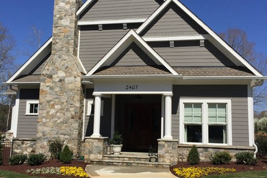 Mid-sized transitional gray one-story concrete fiberboard gable roof photo in Charlotte