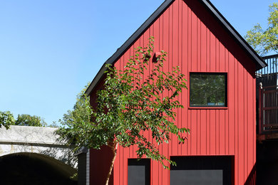 Inspiration for a contemporary red gable roof remodel in Minneapolis