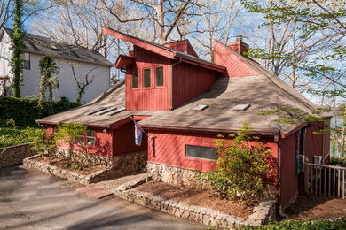 Large contemporary red two-story mixed siding house exterior idea in Atlanta with a shed roof and a shingle roof
