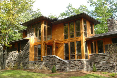 Mid-sized craftsman red split-level wood exterior home idea in Cincinnati