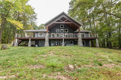 Inspiration for a large craftsman gray two-story concrete fiberboard exterior home remodel in Other with a shingle roof