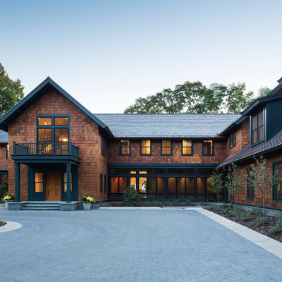 Inspiration for a huge craftsman brown two-story wood exterior home remodel in Minneapolis with a mixed material roof