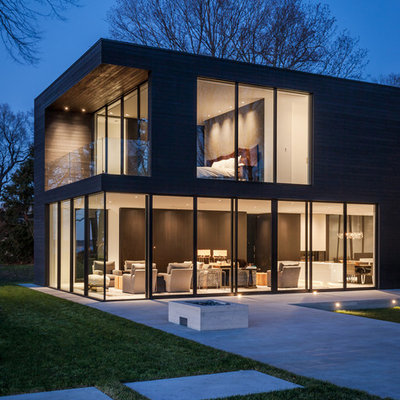 Large modern two-story wood house exterior idea in Minneapolis