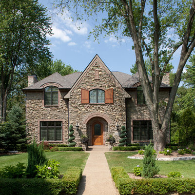 Traditional stone exterior home idea in Detroit