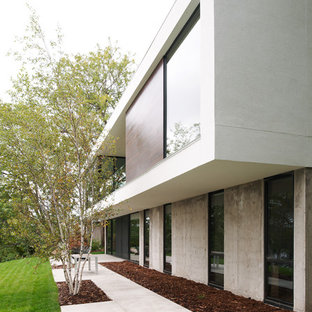 Example of a mid-sized minimalist two-story concrete exterior home design in Minneapolis