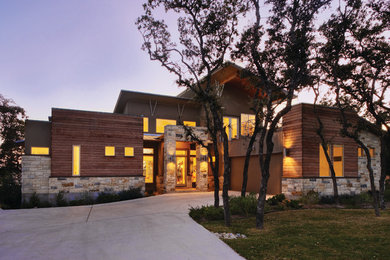 Inspiration for a contemporary brown two-story mixed siding exterior home remodel in Austin