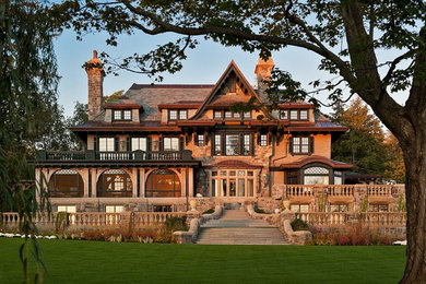 Huge traditional three-story exterior home idea in New York