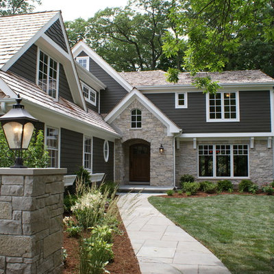 Example of a classic gray two-story mixed siding exterior home design in Chicago