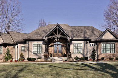 Example of a large arts and crafts brown one-story concrete fiberboard exterior home design in Louisville