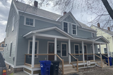 Large elegant gray two-story wood duplex exterior photo in Burlington