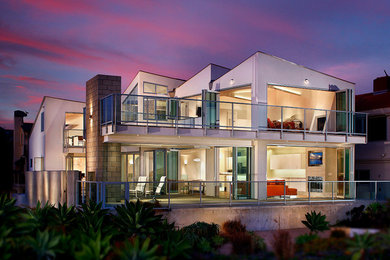 Photo of a large and white modern two floor house exterior in Orange County.