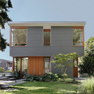 Idee per la villa multicolore contemporanea a due piani di medie dimensioni con rivestimenti misti e tetto piano