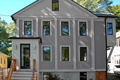 Mid-sized transitional gray three-story mixed siding exterior home photo in Boston with a shingle roof