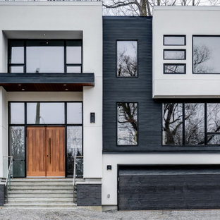 Diseño de fachada de casa multicolor, contemporánea, grande, de dos plantas, con revestimiento de hormigón, tejado plano y tejado de varios materiales