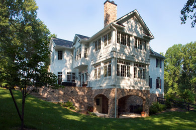 Example of a farmhouse exterior home design in Baltimore