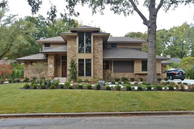 Beige two-story wood house exterior photo in Kansas City with a hip roof and a shingle roof