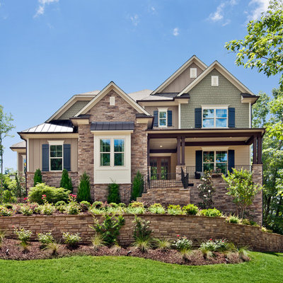 Example of a classic brick exterior home design in Raleigh