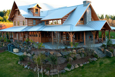 Large rustic brown two-story wood gable roof idea in Portland