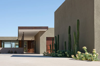 Inspiration for a modern one-story stucco exterior home remodel in Phoenix