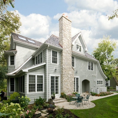Mid-sized traditional gray two-story vinyl gable roof idea in Chicago