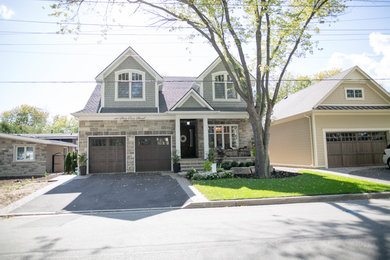 Photo of a medium sized and gey traditional two floor detached house in Toronto with mixed cladding, a pitched roof and a shingle roof.