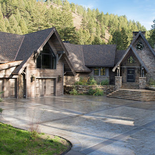 Inspiration for a huge rustic three-story mixed siding exterior home remodel in Other