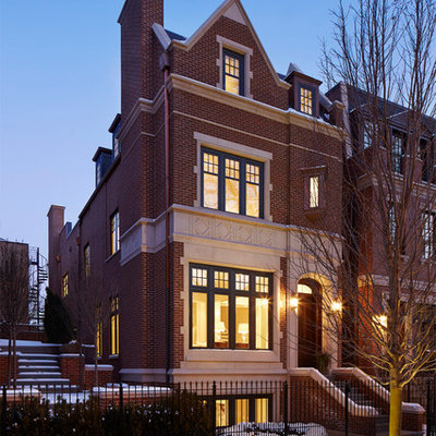 Inspiration for a large timeless brown three-story brick exterior home remodel in Chicago