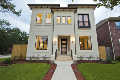 Mid-sized trendy white two-story concrete house exterior photo in Houston with a hip roof and a shingle roof