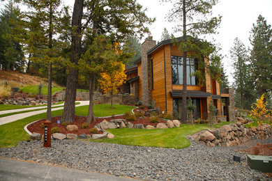 Inspiration for a huge craftsman brown two-story wood exterior home remodel in Seattle with a clipped gable roof