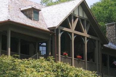 Inspiration for a brown two-story wood exterior home remodel in Other