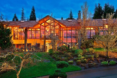 Mountain style two-story wood exterior home photo in Seattle