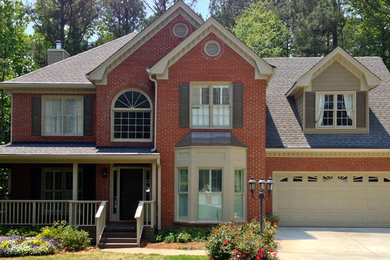 Elegant beige two-story brick exterior home photo in Atlanta