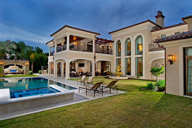 Example of a huge tuscan exterior home design in Orlando